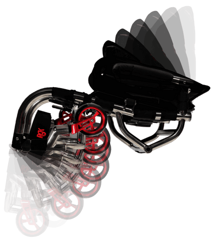 A compact folding wheelchair shown on a plain white background, with a black seat and frame, silver metal tubulars, and red wheel rims. A motion-style overlay shows the folded and unfolded positions.