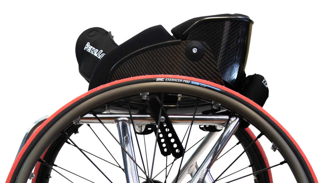 Close-up of a wheelchair with a black seat and red accents on a white background ergk elite cx