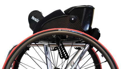 Close-up of a wheelchair with a black seat and red accents on a white background ergk elite cx