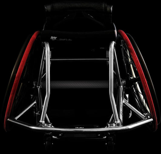 Close-up of a wheelchair with red accents on a black background rgk elite x