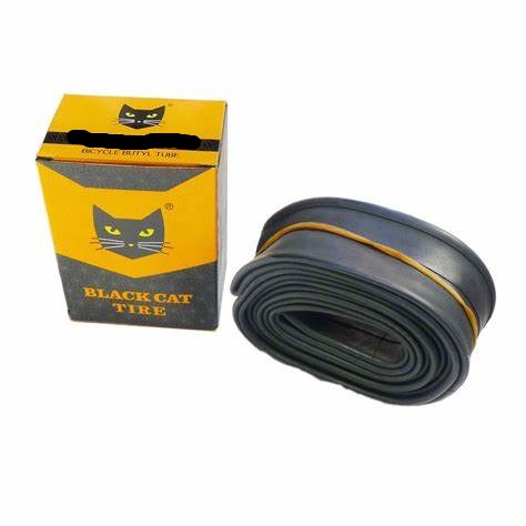 A coiled wheelchair inner tube alongside its product packaging box which has a black cat logo.